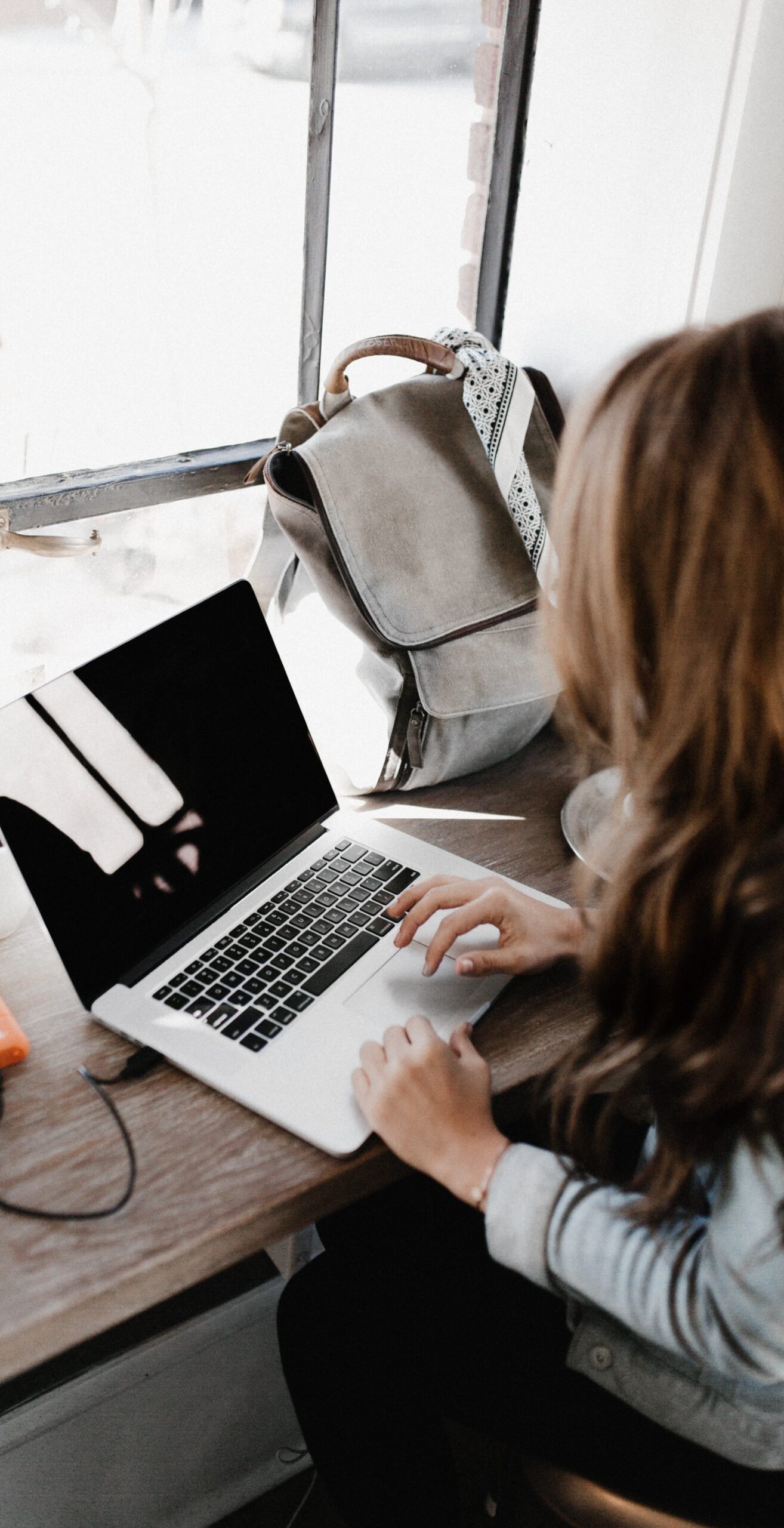 woman typing at computer