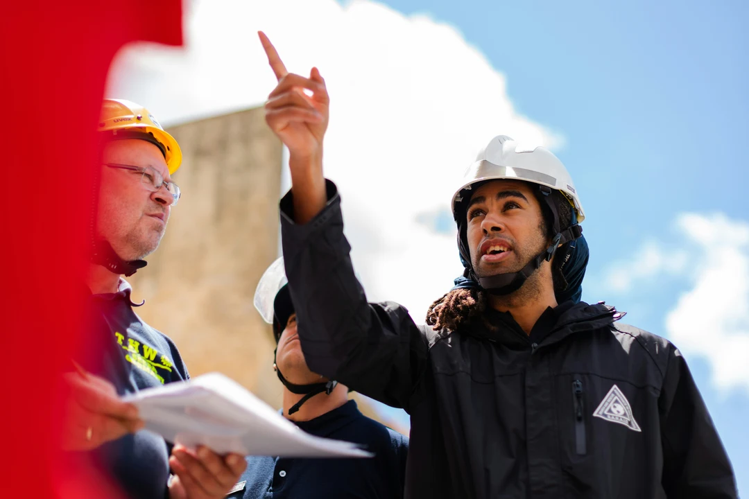 Industrial Engineer pointing and explaining a project to his team