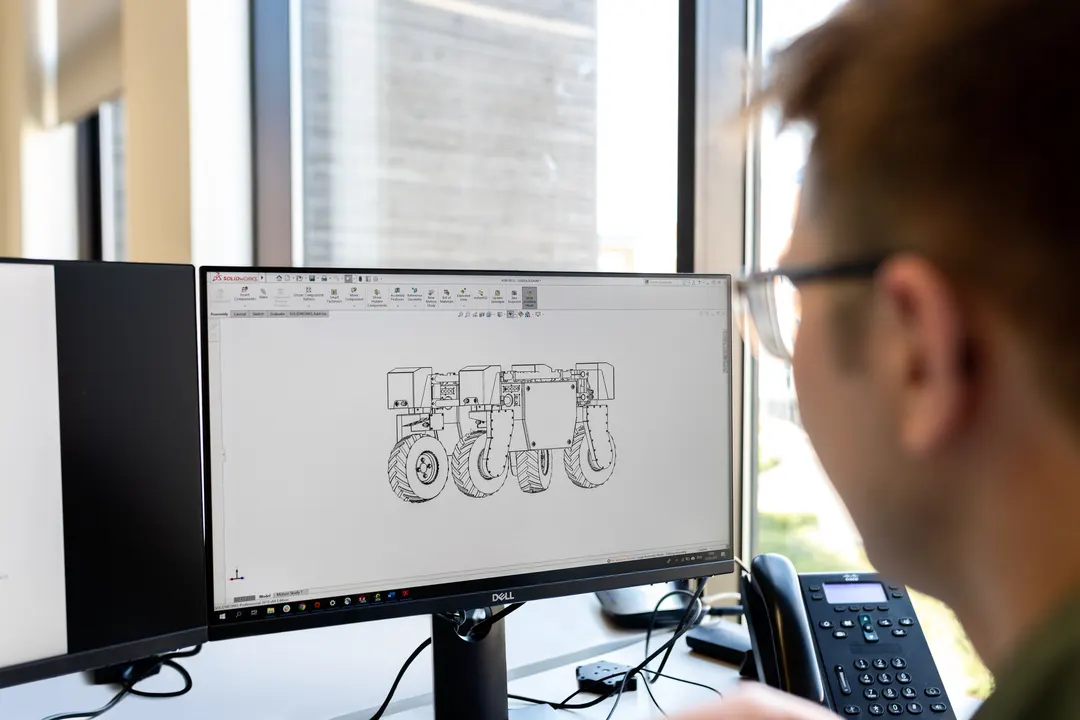 Mechanical Engineer working on a computer