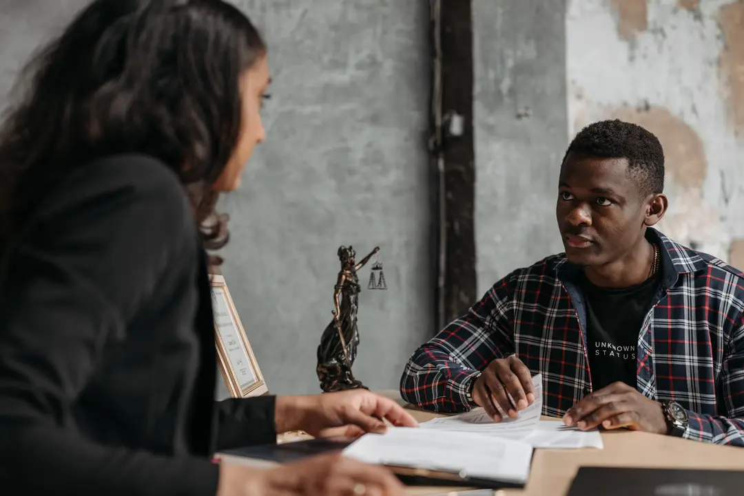 Lawyer and client talking at a desk